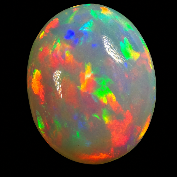 7.57ct AAA quality Natural Ethiopian Welo Opal – Oval Cabochon – Fiery Red, Neon Green & Electric Blue Fire – Rolling Broadflash Pattern – AAA Collector Grade